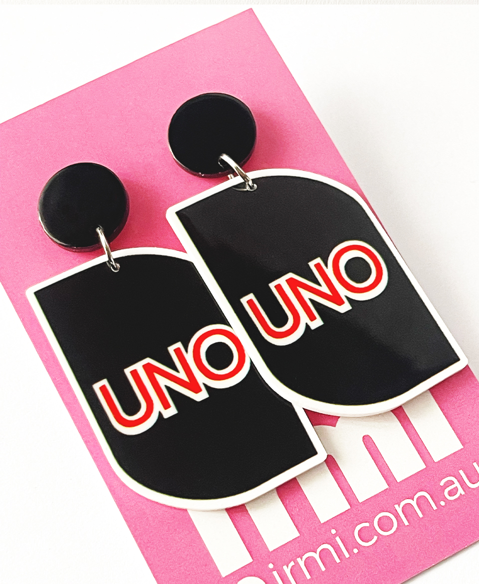 These playful and bold earrings are inspired by the iconic UNO card game, bringing a touch of nostalgia and fun to your accessories collection.