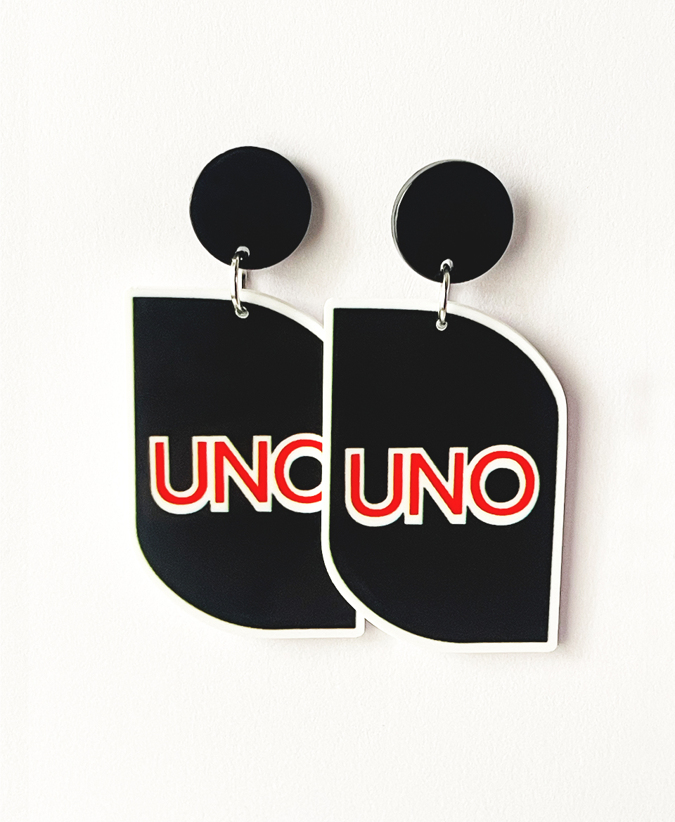 These playful and bold earrings are inspired by the iconic UNO card game, bringing a touch of nostalgia and fun to your accessories collection.