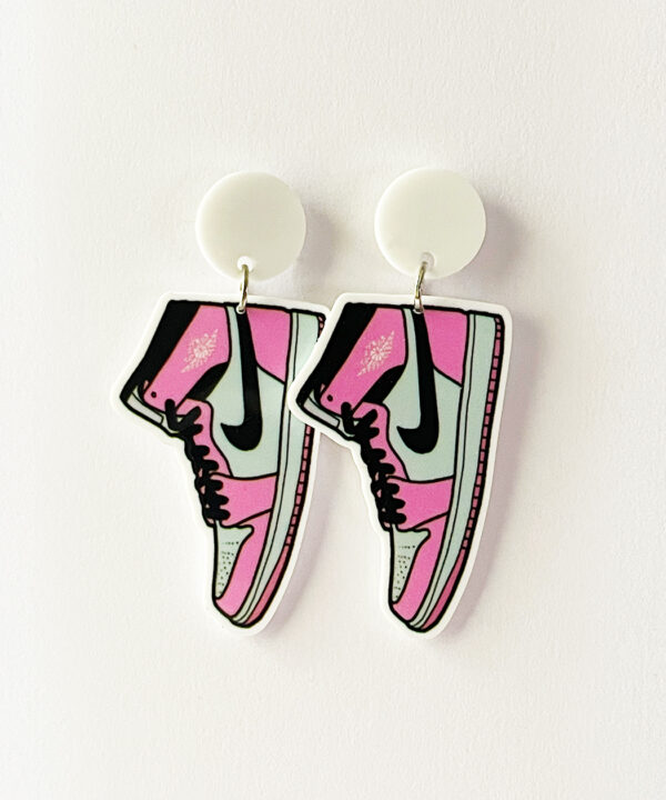 Step up your accessory game with these fun and stylish pink Air Force One-shaped earrings!