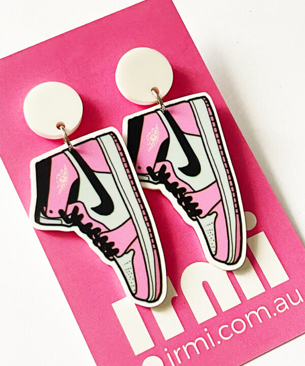 Step up your accessory game with these fun and stylish pink Air Force One-shaped earrings!