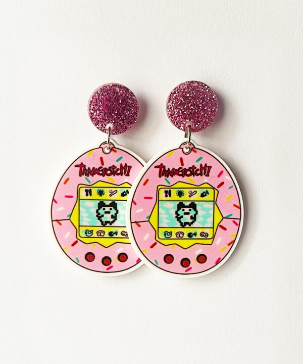 Bring a wave of nostalgic fun to your style with these Tamagotchi-inspired earrings!